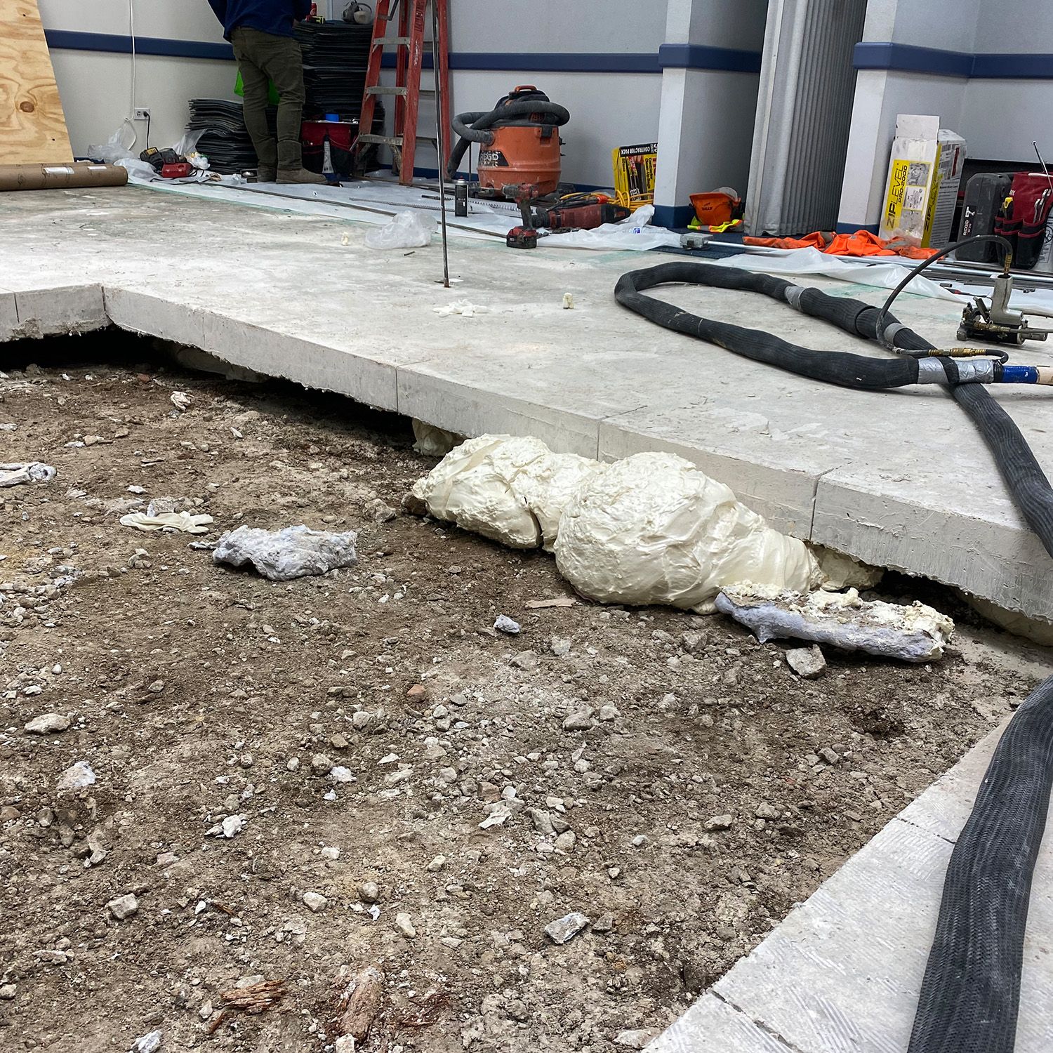 Soil densification, concrete raising, and void filling