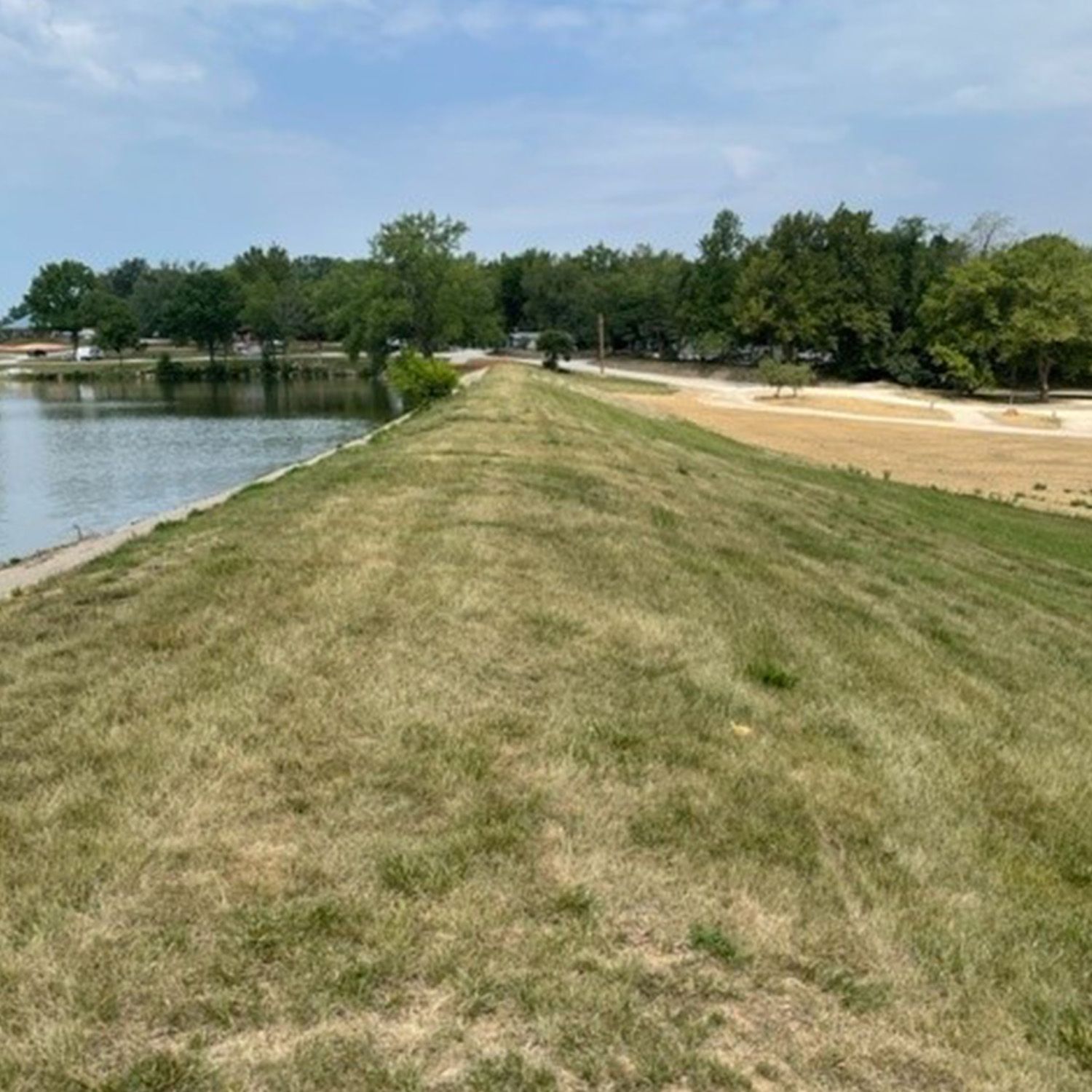 Compaction grouting to provide soil improvement to inhibit soil erosion from water migration, void filing, and create water cut off.